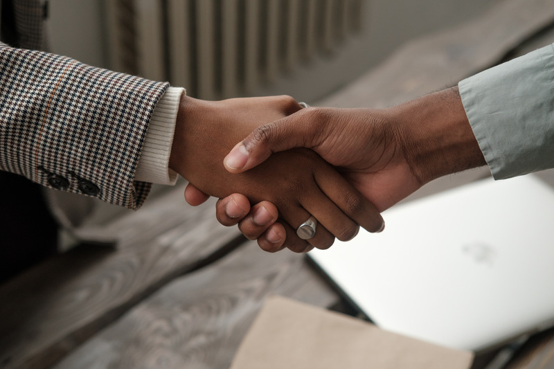 Business partnership handshake